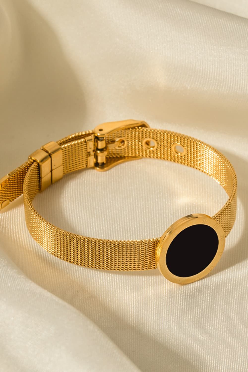 Gold Buckle Bracelet With A Black Disc
